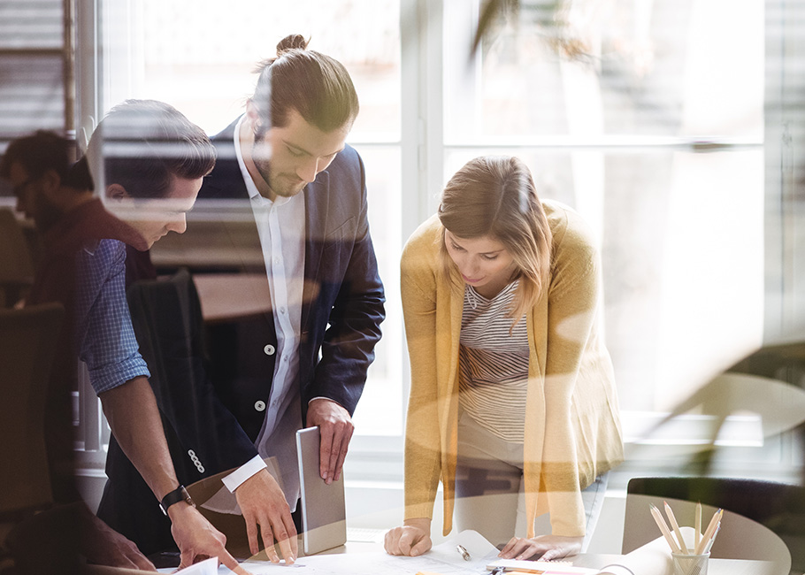 Three business people working with Capital Planning Software
